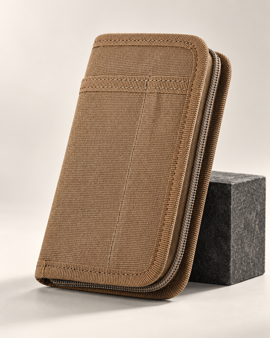 Brown Fieldwork canvas zip-around cover with front slip pocket and grey zip