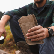 Brown Fieldwork cover held in one hand outdoors